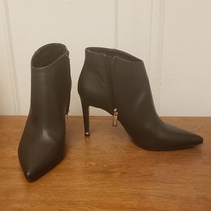 Black genuine leather ankle boots.